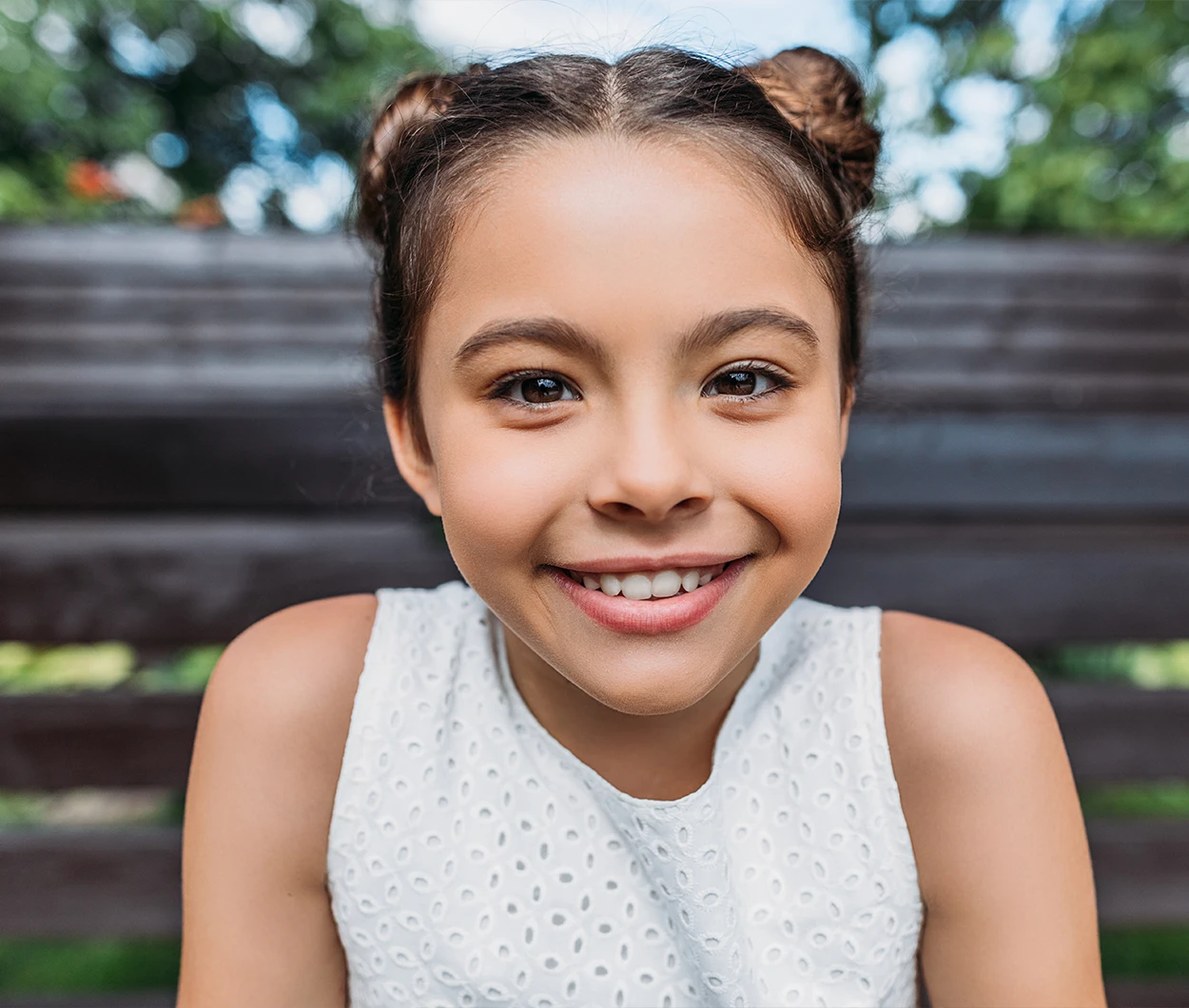 Smiling girl with braces, showcasing healthy teeth and alignment, representing orthodontic care for children at Boller Orthodontic Arts.